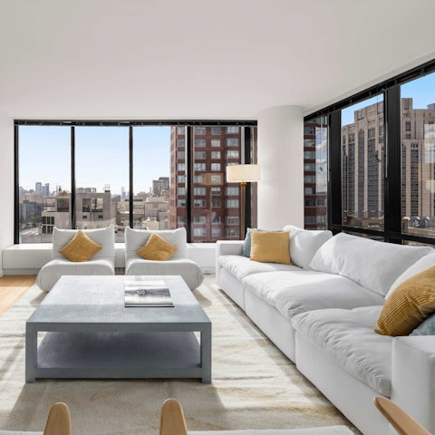 Enjoy city views through floor-to-ceiling windows