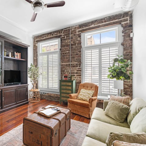 Kick back in the loft-style living space – we love the exposed brick