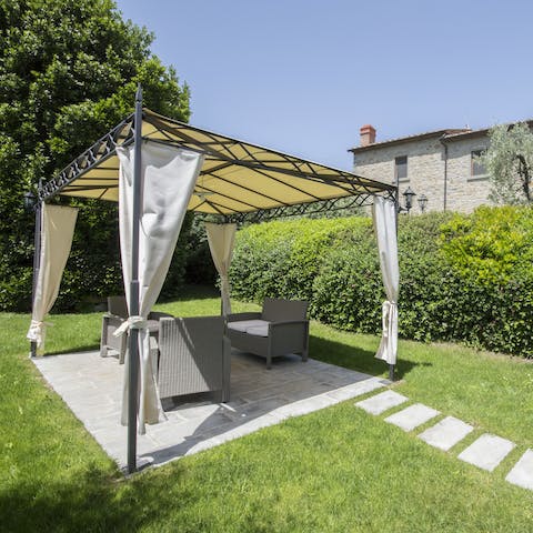 Sit back in the shade and enjoy a glass of wine over conversation