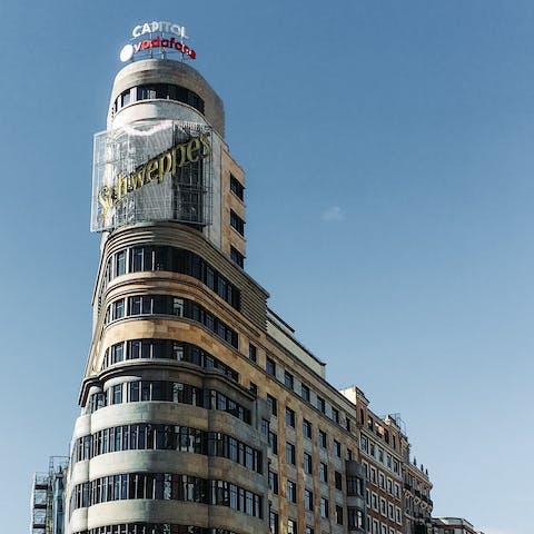 Embrace the buzz of city living with an atmospheric stroll along Gran Via – only three–minutes away