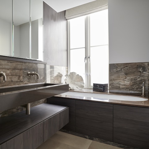 Take a restorative soak in the marble bathtub after a day of pounding the pavements