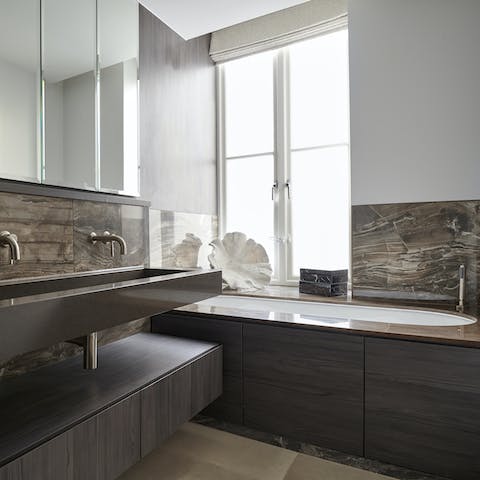 Take a restorative soak in the marble bathtub after a day of pounding the pavements