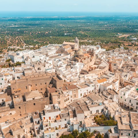Visit the whitewashed city of Ostuni, a short drive away