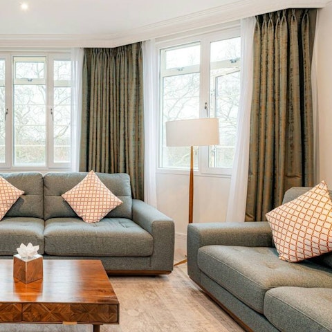 Sink into the plush sofa with a glass of wine, admiring the views from the Juliet balcony