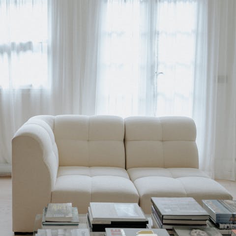 Curl up on the sofa with a book from the host's collection
