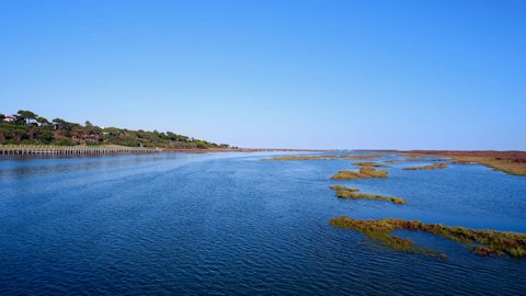 Explore Melides Lagoon, a serene wetland teeming with birds and wild Atlantic beauty