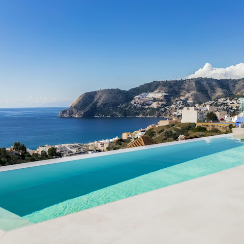 Soak up the sea views while swimming in the infinity pool