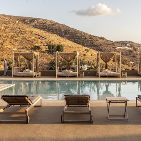 Relax by the pool with a view of the rugged landscape
