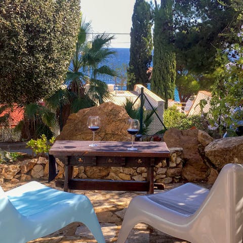 Sit with drinks on the picturesque patio