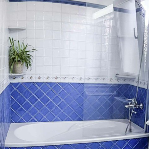 Unwind in the bath tub after a day of discovering the local cove beaches