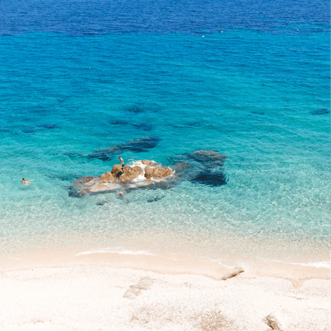 Discover the clear waters, sheltered bay and waterfront bars of Platis Gialos