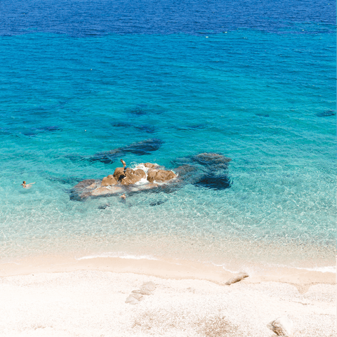Discover the clear waters, sheltered bay and waterfront bars of Platis Gialos