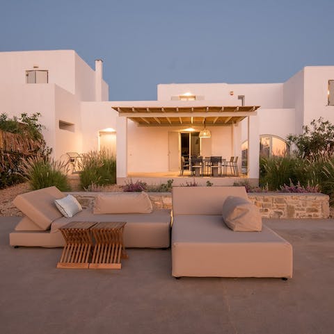 Read or recline on luxe loungers in the sun
