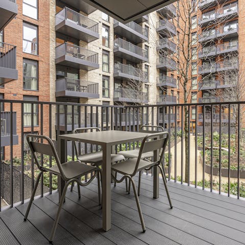 Enjoy a glass of craft beer on the balcony overlooking the communal courtyard