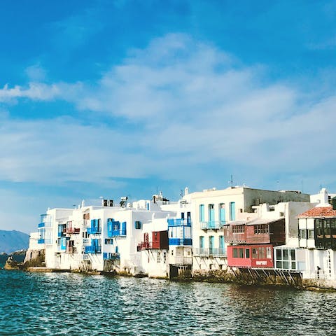 Make your way to Mykonos Town, a fifteen-minute drive away, and settle in to a local tavern for the night