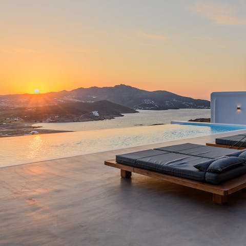 Kick back on the sleek loungers, cocktail in hand, as you watch the glowing sun dip behind the mountains