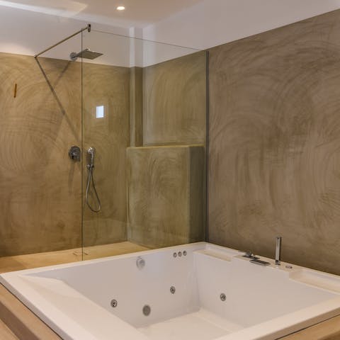 Rinse off the day in your rain shower before sinking into the huge jacuzzi style tub