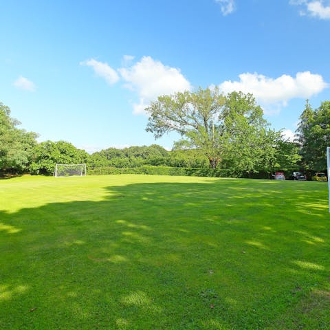 Have a kickaround on the football pitch