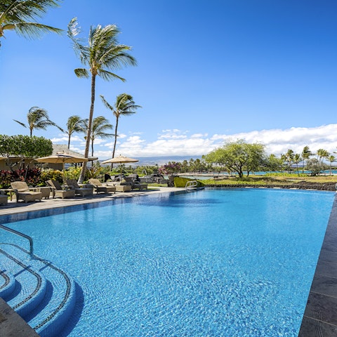 Head to the communal pool on a warm afternoon