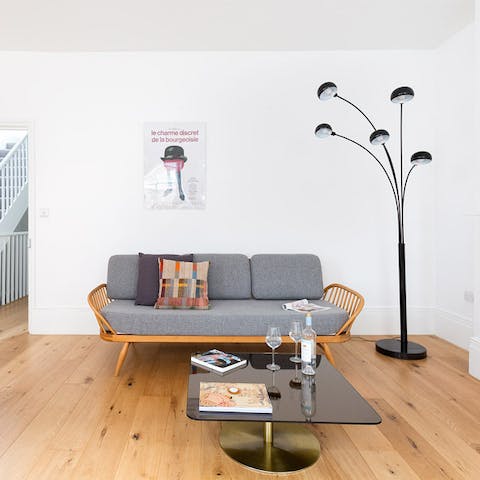 Enjoy a glass of wine on the Ercol Daybed