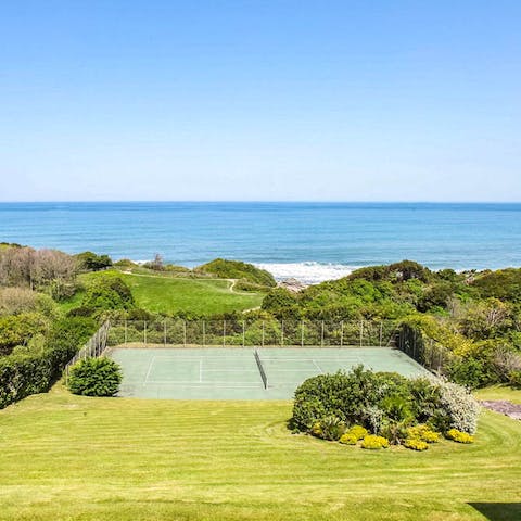 Try not to be distracted by the gorgeous view on the tennis court
