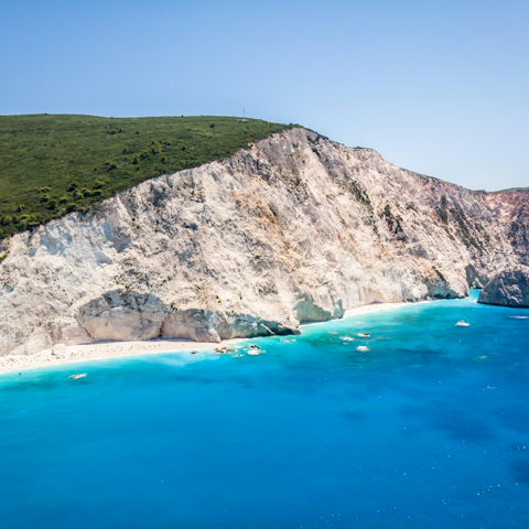 Take a boat ride out to explore the island's rocky coastline