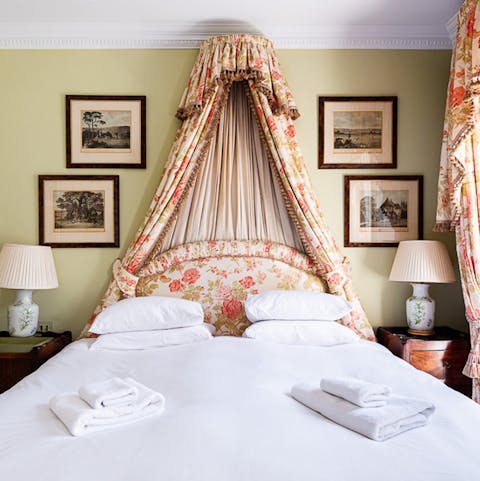 Snuggle up in the main bedroom after a soak in the bathtub