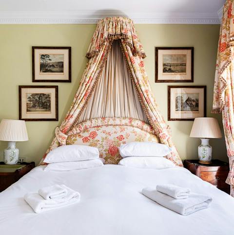 Snuggle up in the main bedroom after a soak in the bathtub
