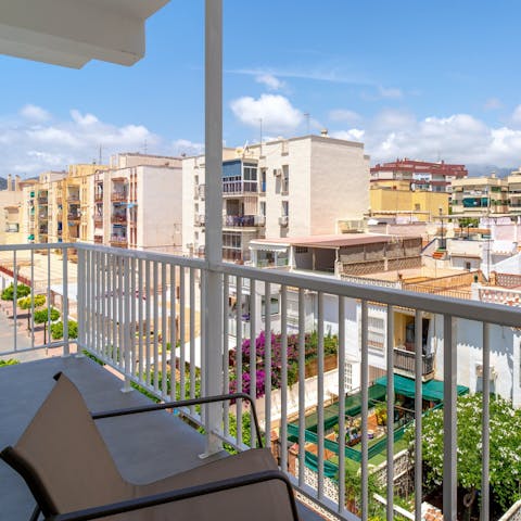 Enjoy a glass of sangria on the balcony