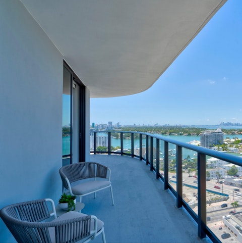 Sit back on the balcony Biscayne Bay spreads out before you