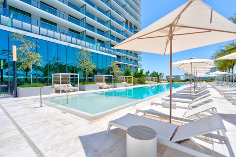 Stretch out on sun loungers beside the gleaming shared pool