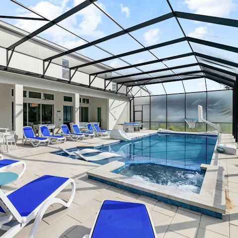 Play and relax in the spacious screened pool area