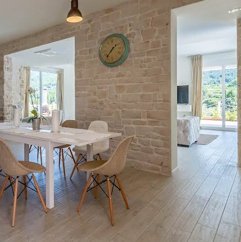 Huge windows and an open-plan space mean the home is flooded with light