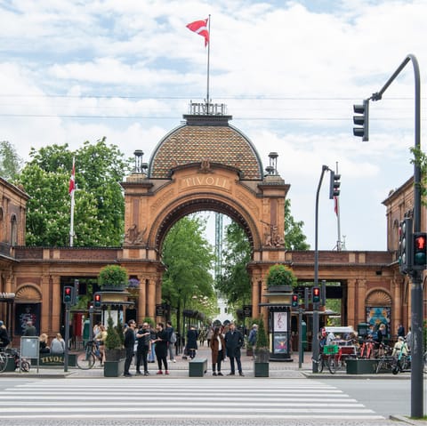 Ride the roller coaster at the nearby Tivoli Gardens