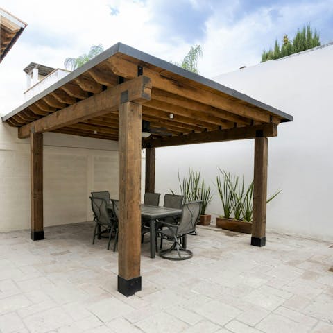 Dine alfresco in the shaded outdoor area on a hot afternoon