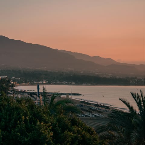 Watch the sunset on the soft sand of Venus Beach
