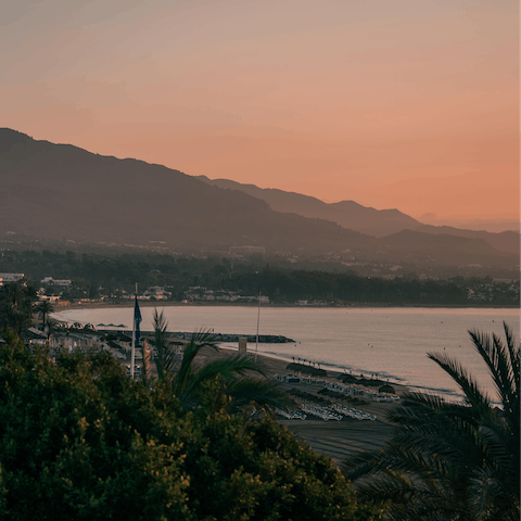 Watch the sunset on the soft sand of Venus Beach