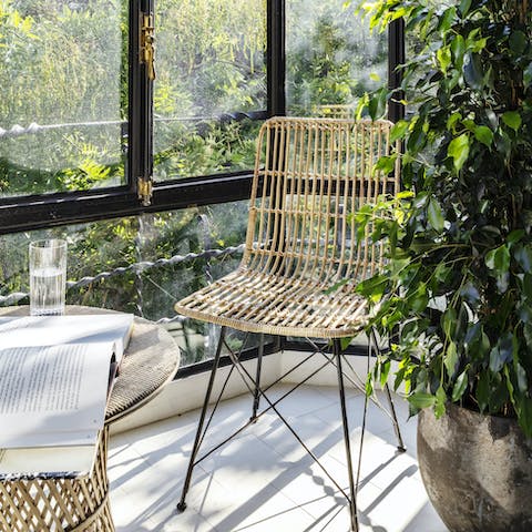 Relax with a good book and glass of wine in the sunroom