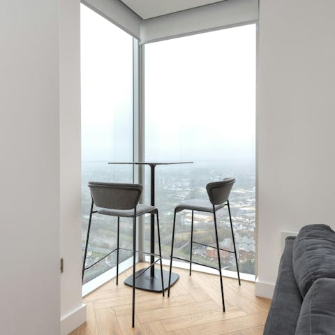 Take a seat at the bar table and admire the skyline