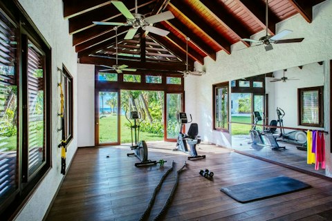 Work out in a light-filled gym opening onto tropical gardens
