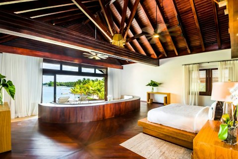 Wake to open water views framed by tropical palms