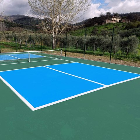 Challenge each other to a game on the private tennis court