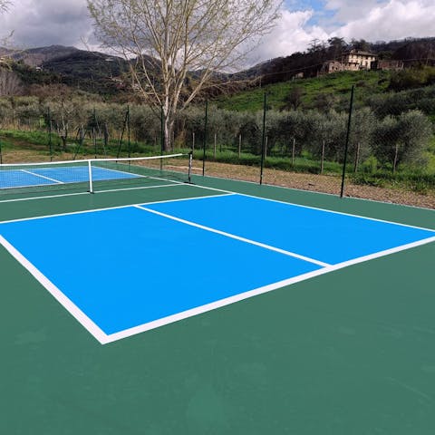 Challenge each other to a game on the private tennis court