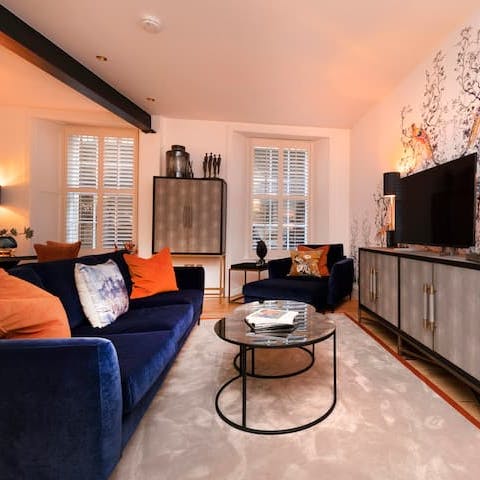 Take a seat on the plush, blue velvet sofa after a busy day of sightseeing in Scotland's capital