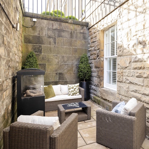 Relax with a wee dram next to the outdoor fireplace when the Scottish weather turns chilly