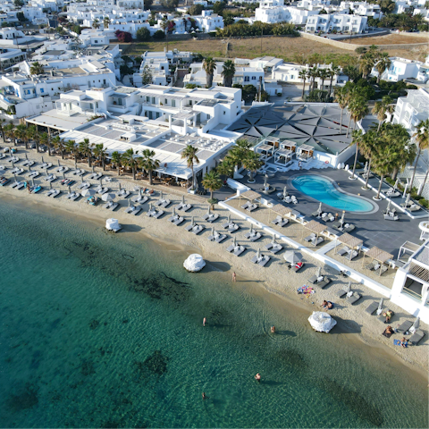 Soak up the buzz of Mykonos from Ornos Beach – a short drive away
