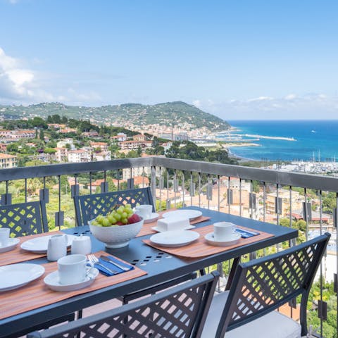 Enjoy dinner and drinks as the sun goes down on the balcony