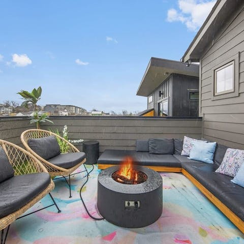 Relax by the fire pit on the rooftop terrace