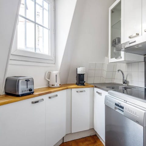 Cater to your morning coffee needs in the cute kitchen