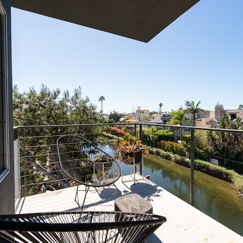 Sip your morning coffee on the balcony overlooking the canals